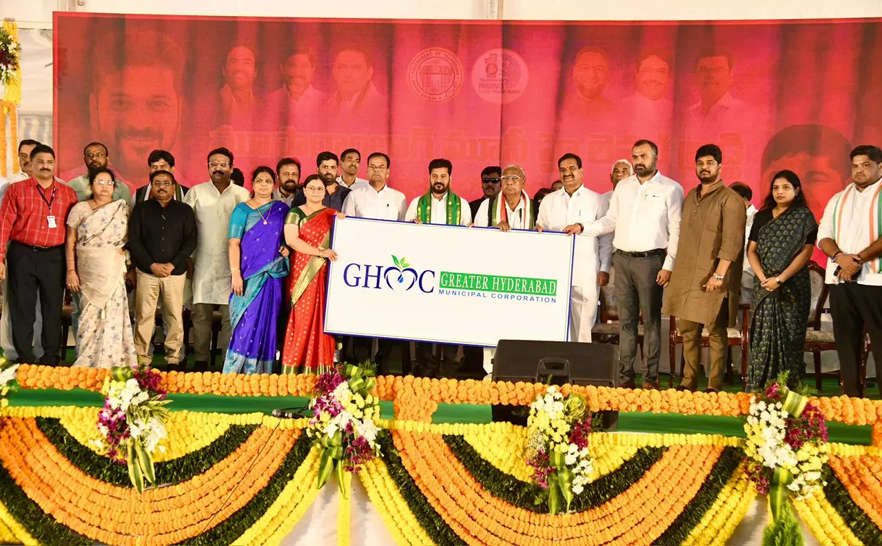 Revanth Reddy Unveils New Logos for CMC, MMC and GHMC Revanth Reddy Unveils New Logos for CMC, MMC and GHMC