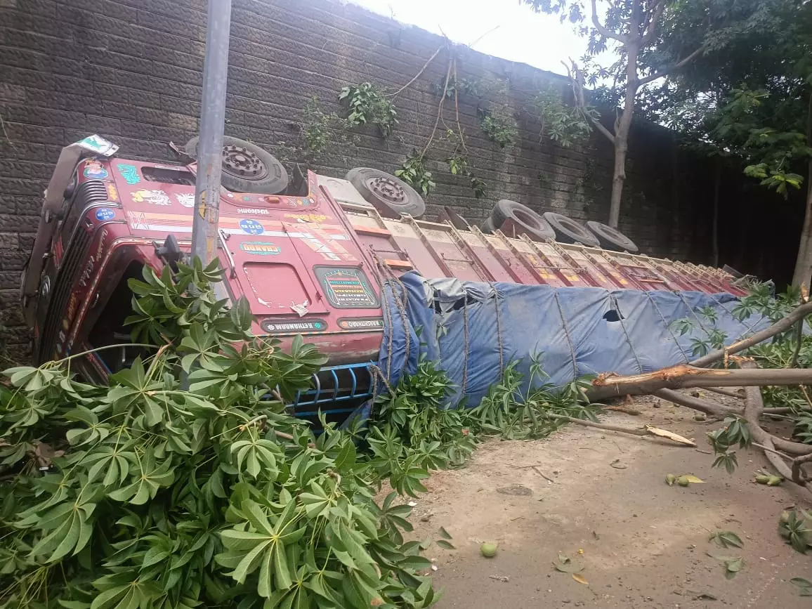 Lorry Carrying Cement Bags Plunges from ORR in Shamshabad; Driver Injured Lorry Carrying Cement Bags Plunges from ORR in Shamshabad; Driver Injured