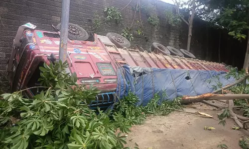 Lorry Carrying Cement Bags Plunges from ORR in Shamshabad; Driver Injured Lorry Carrying Cement Bags Plunges from ORR in Shamshabad; Driver Injured