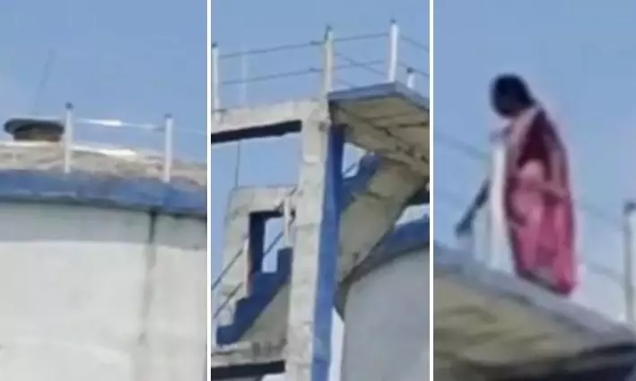 Adilabad: Woman Climbs Mission Bhagiratha Water Tank, Threatens to Jump Adilabad: Woman Climbs Mission Bhagiratha Water Tank, Threatens to Jump