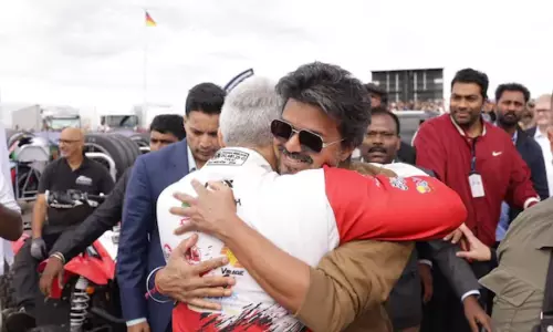 TN CM Vijay, Ajith Share Warm Hug on UK Racetrack TN CM Vijay, Ajith Share Warm Hug on UK Racetrack