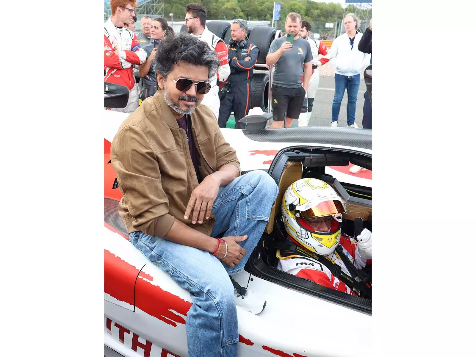 Vijay Flags Off Ajith Kumar’s Race at Silverstone; Trisha Krishnan Joins From Grandstands Vijay Flags Off Ajith Kumar’s Race at Silverstone; Trisha Krishnan Joins From Grandstands