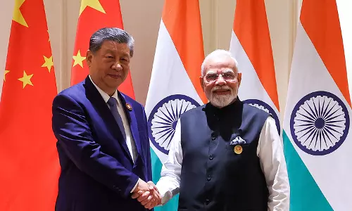 Xi, Modi Reach Consensus that India-China Should be Partners: Wang Yi