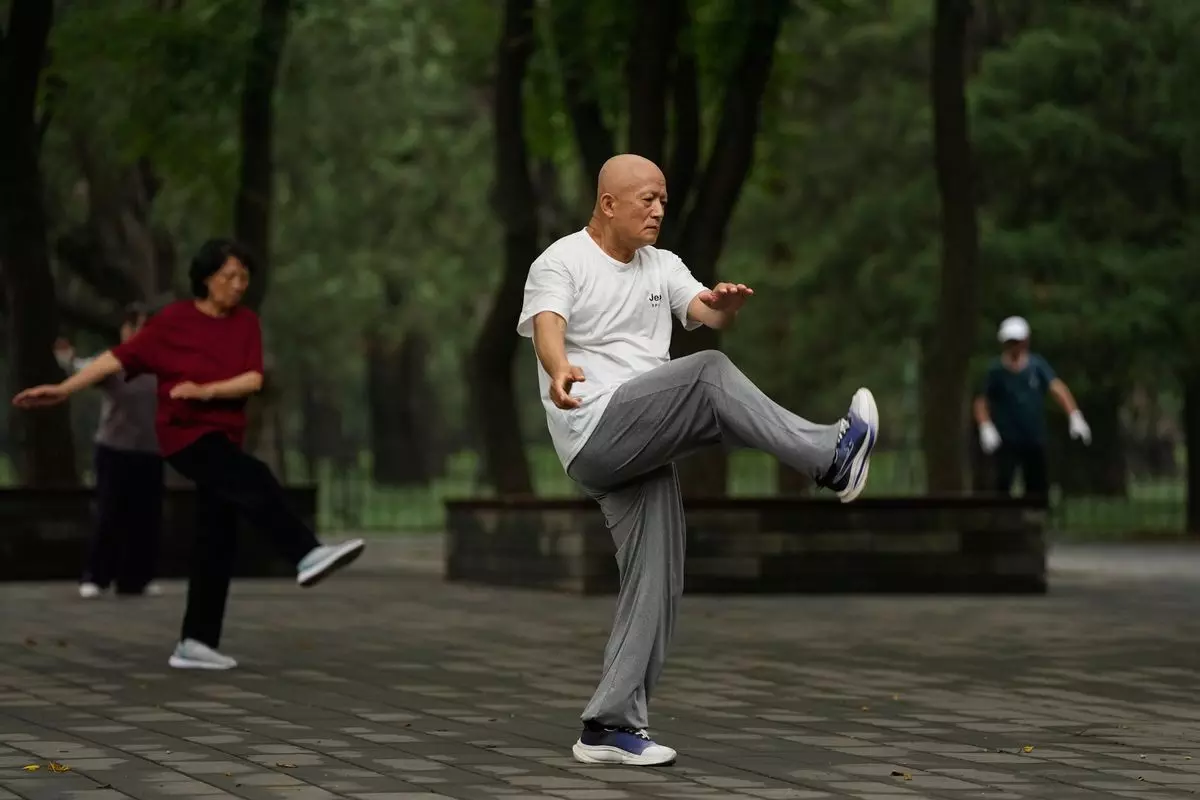 Tai Chi Practitioners Seek Balance and Well-Being in Fast-Paced Beijing Tai Chi Practitioners Seek Balance and Well-Being in Fast-Paced Beijing