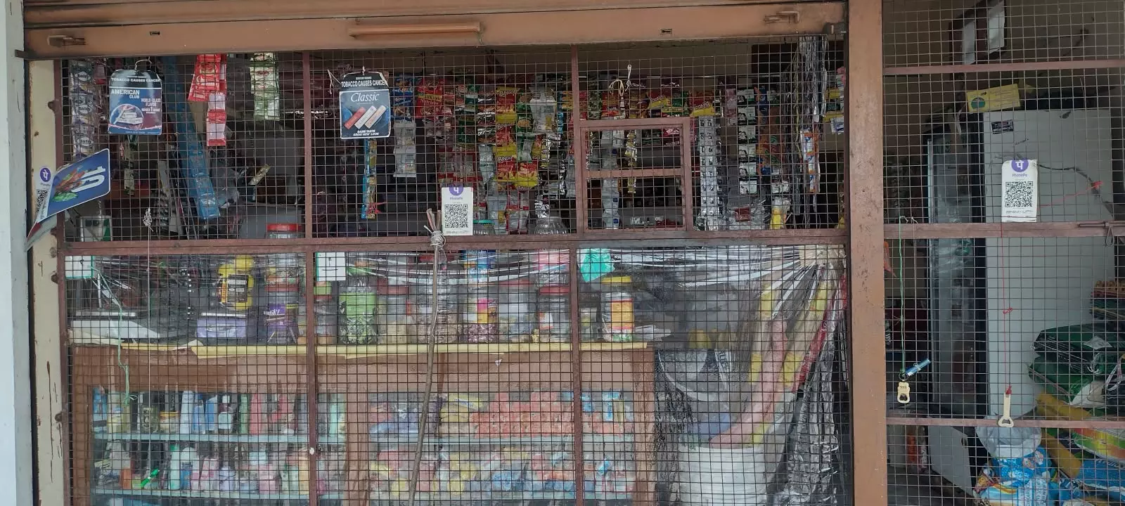 Monkey menace: Iron grills put to protect food items in Kirana stores Monkey menace: Iron grills put to protect food items in Kirana stores