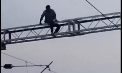 Nekkonda Man Climbs Railway Electric Pole, Disrupts Train Services Nekkonda Man Climbs Railway Electric Pole, Disrupts Train Services