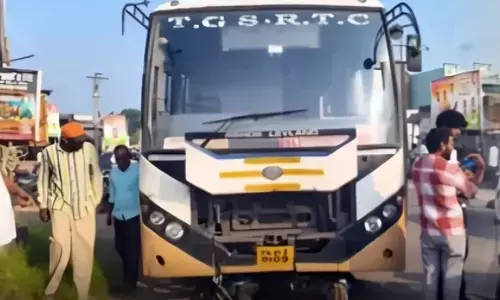 Karimnagar: Father, Young Son Hurt in Collision with Jagtial RTC Bus Karimnagar: Father, Young Son Hurt in Collision with Jagtial RTC Bus